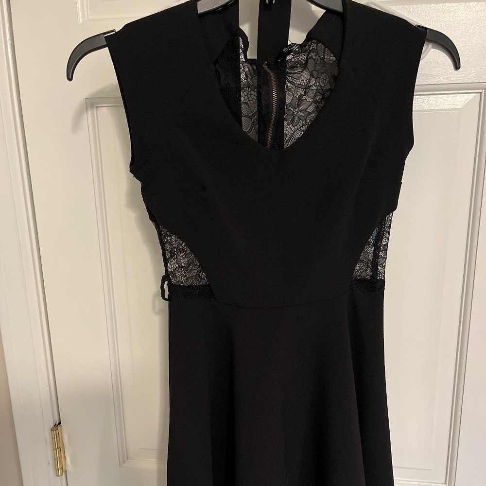 Black  mini dress with lace cut out, sides and back
